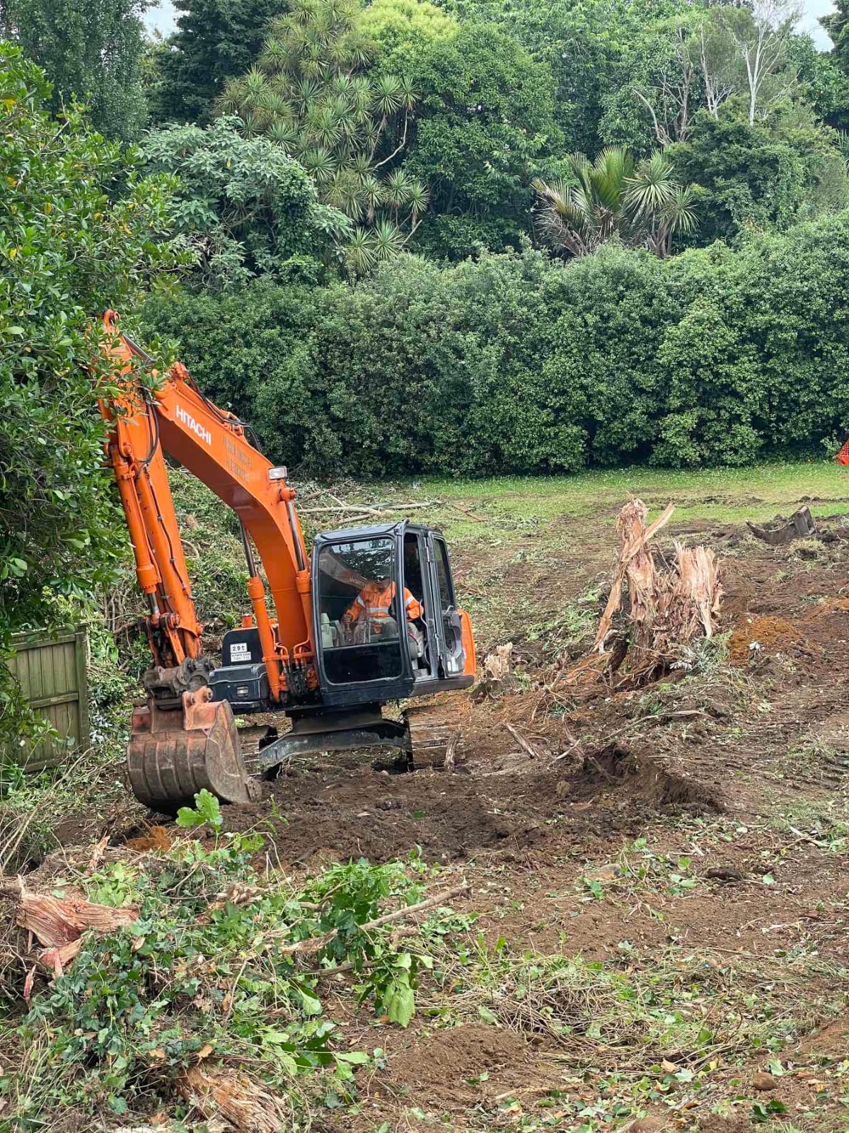 Excavator completing earthworks on an Auckland site